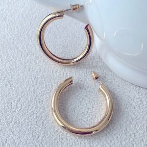 Thick gold hoop earrings
